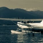 a small plane sitting on top of a body of water