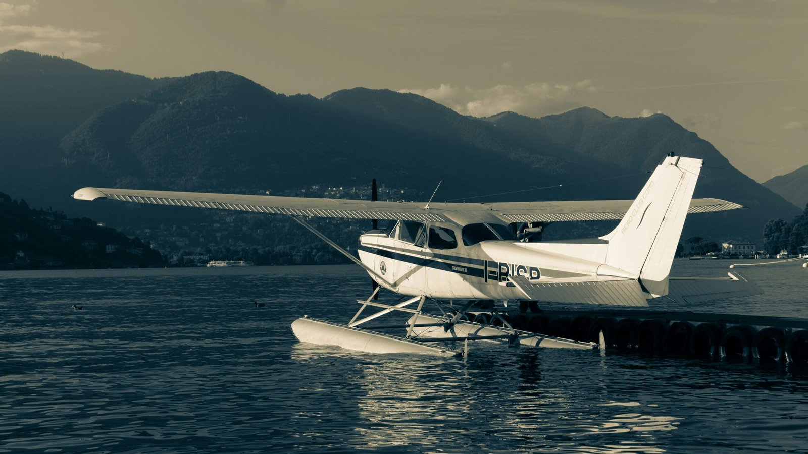 a small plane sitting on top of a body of water